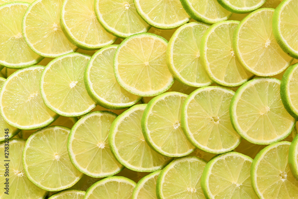 Fresh lime slices as a background.