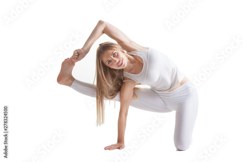 beautiful flexible woman doing yoga poses on white