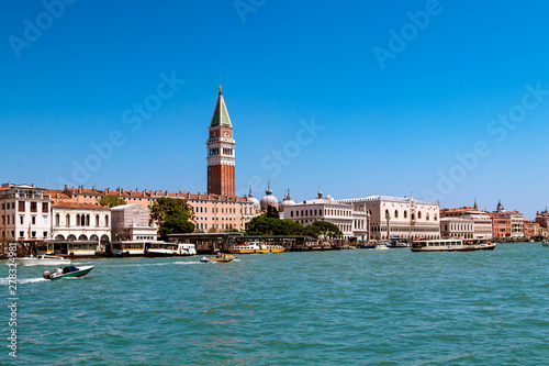 Beautiful view of Venice, Italy with Campanile tower of Saint Mark's Cathedral, Basilica on San Marco square and Doges' Palace. Italian buildings cityscape. Famous romantic city on water.