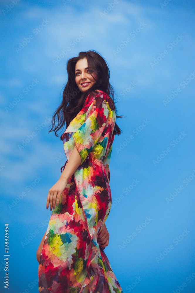 Artistic sensual young woman posing on the sand Artistic sensual young woman posing on the sand