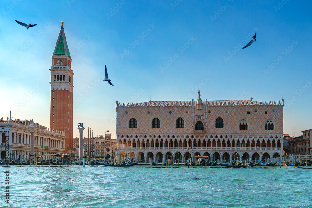 Beautiful view of Venice, Italy with Campanile tower of Saint Mark's Cathedral, Basilica on San Marco square and Doges' Palace. Italian buildings cityscape. Famous romantic city on water.