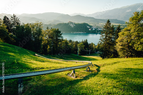 Fototapeta Hill with perfect view on lake and castle