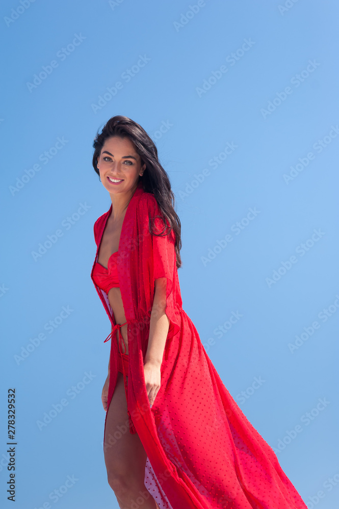 Summer Fashion. Sexy European Woman In Red Swimsuit On Beach Summer Fashion. Sexy European Woman In Red Swimsuit On Beach