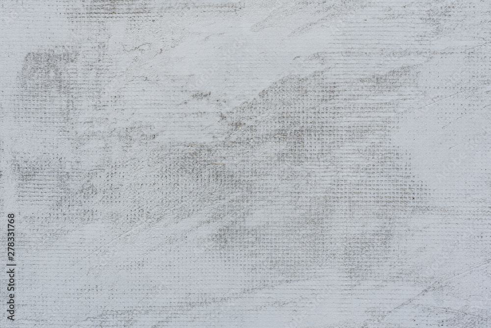 Naklejka premium Texture of a concrete wall with cracks and scratches which can be used as a background