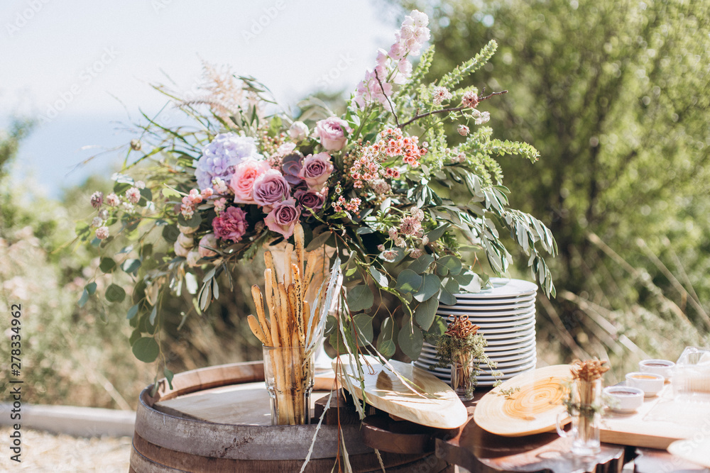 Fototapeta premium Boho wedding table with eco decor for guests.