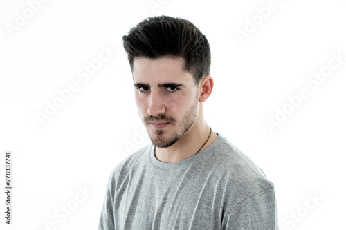 Human expressions and emotions. Young attractive annoyed man with an angry face
