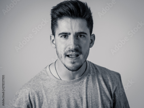 Human expressions and emotions. Young attractive annoyed man with an angry face