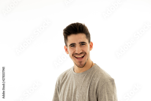 Portrait of smiling attractive cheerful young man face. In human facial emotions and expressions