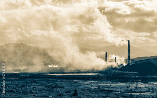 Industrial landscape. From pipe factory smoke, polluting the atmosphere. HDR image