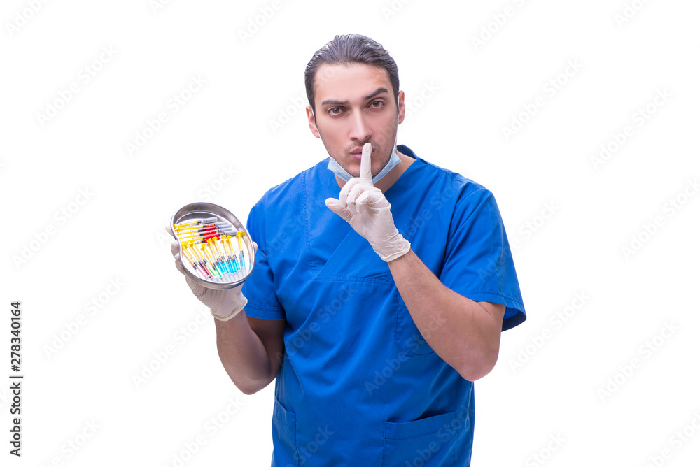 Obraz premium Young handsome doctor with syringe isolated on white