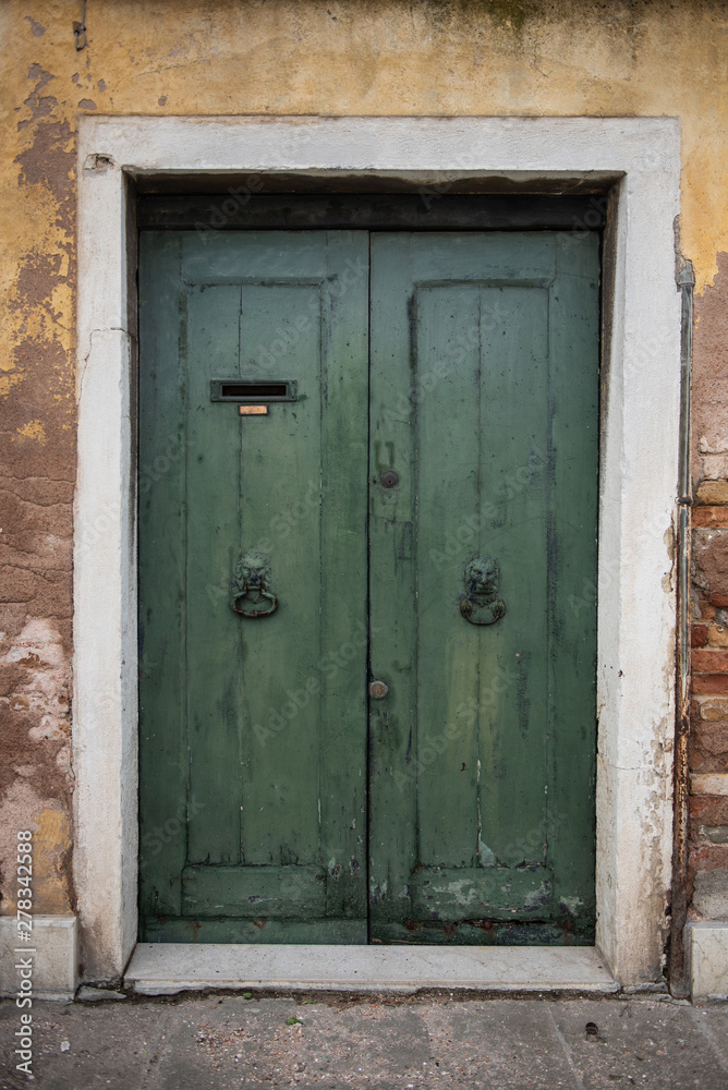 Old beautiful door in the Venetian style