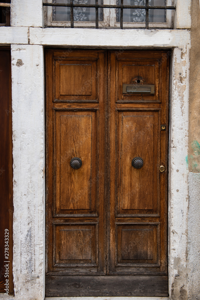 Old beautiful door in the Venetian style