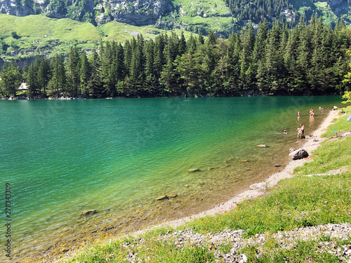 A picturesque circular walking trail along the Seealpsee alpine lake and in the Appenzellerland Tourist Region - Canton of Appenzell Innerrhoden (AI), Switzerland photo