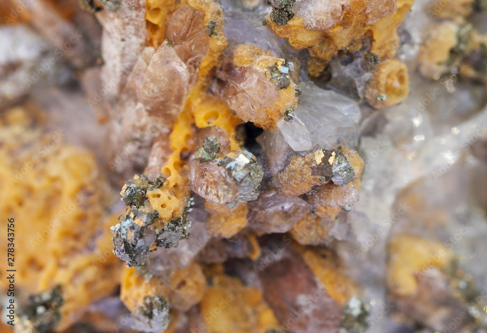 Mineral, yellow calcite and pyrite close up
