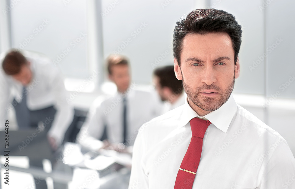 close up.serious businessman standing in the office. close up.serious businessman standing in the office.