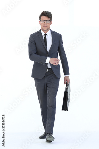 confident businessman with leather briefcase goes forward