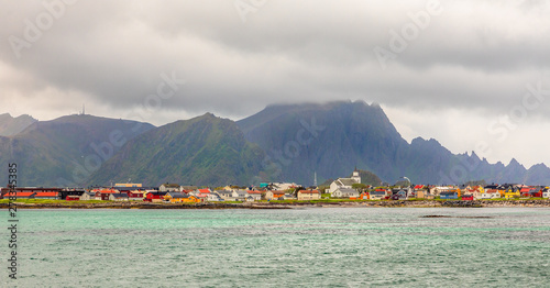 Andenes village panorama with multiple houses and mountains in the background, Lofoten islands, Andoy Municipality, Vesteralen district, Nordland county, Norway