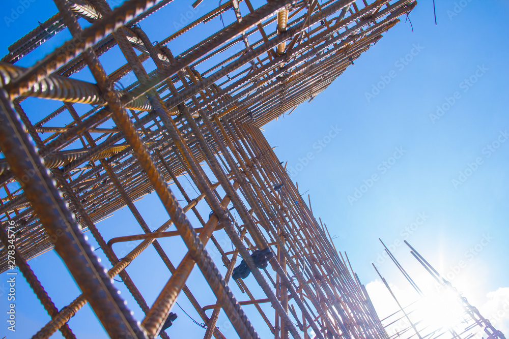 Armature against the blue sky. Metal base of reinforced concrete walls. Part of the structure of the building of reinforced concrete. Armature against the blue sky. Metal base of reinforced concrete walls. Part of the structure of the building of reinforced concrete.
