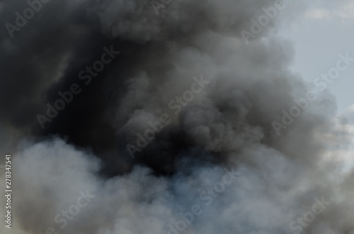 Black smoke fire clouds background