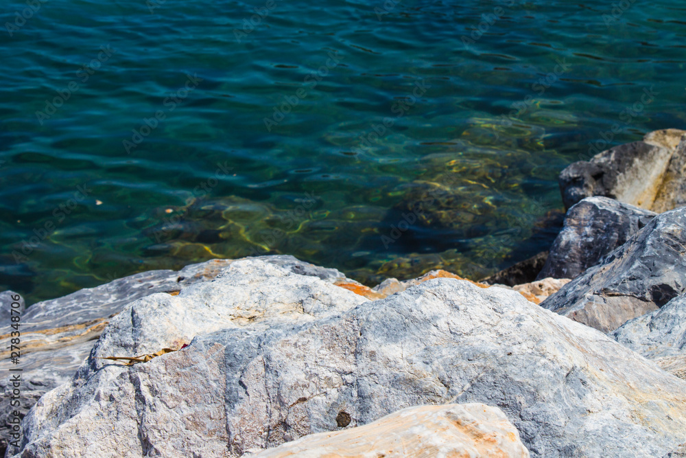 White cliffs and bright blue Mediterranean sea. Rest on the Mediterranean sea in Turkey. Summer, Sunny day White cliffs and bright blue Mediterranean sea. Rest on the Mediterranean sea in Turkey. Summer, Sunny day