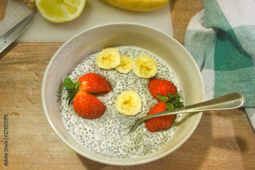 Chia seed  pudding with strawberrry and banan slices. Quinoa porridge. Vegetarian food.
