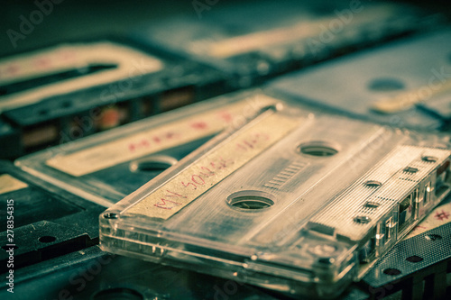 Closeup of old audio cassettes on grey table