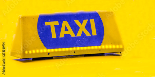 Taxi letter in golden background