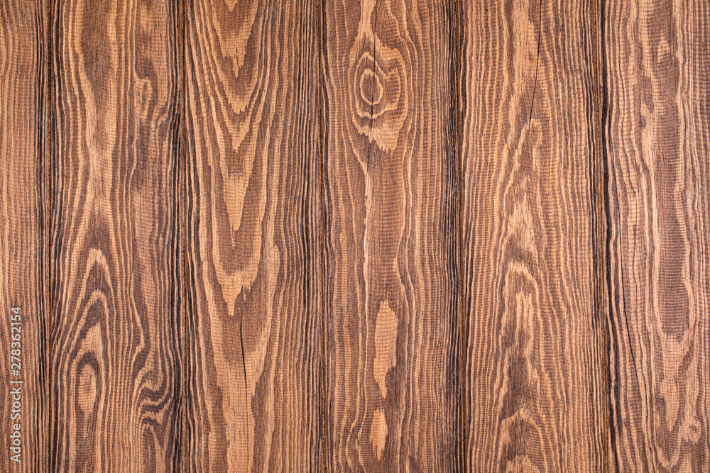 Naklejka premium Textured wooden board. Brown background for photos. Parquet board.