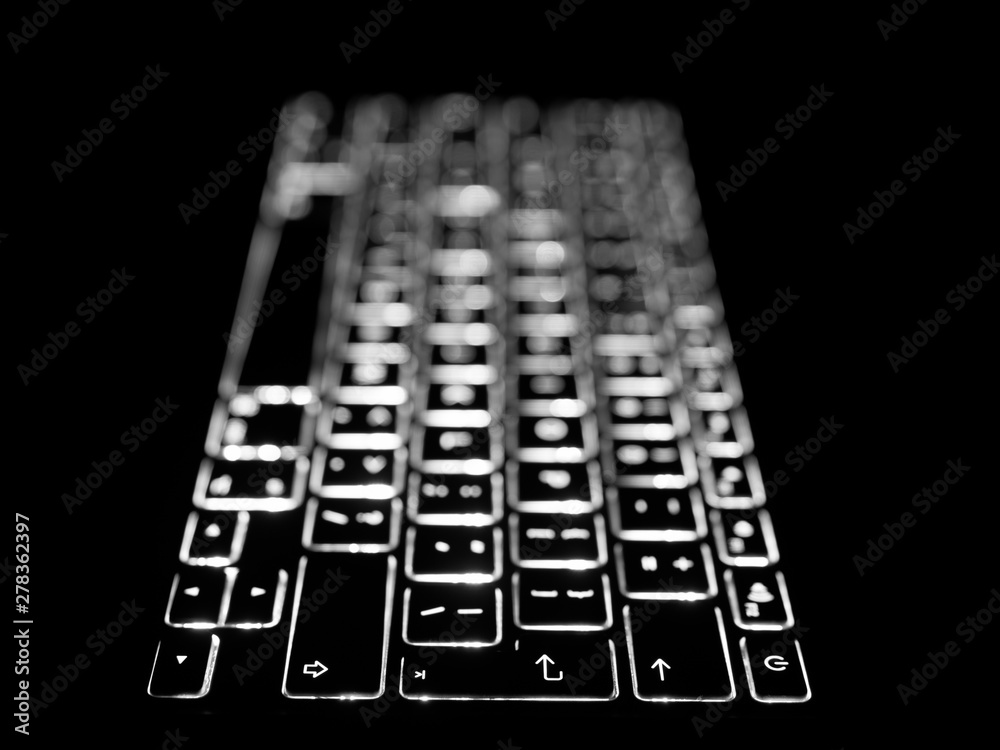 Black and white close-up on illuminated keys of computer keyboard. Black and white close-up on illuminated keys of computer keyboard.