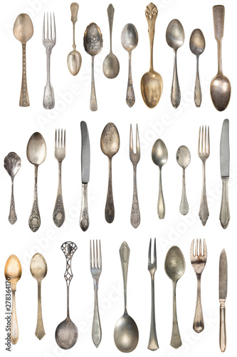 Vintage Silverware, antique spoons, forks, knives, ladle, cake shovels isolated on isolated white background. Antique silverware. Retro.
