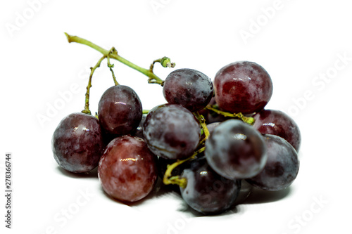 Bunch of red grapes isolated on white background.