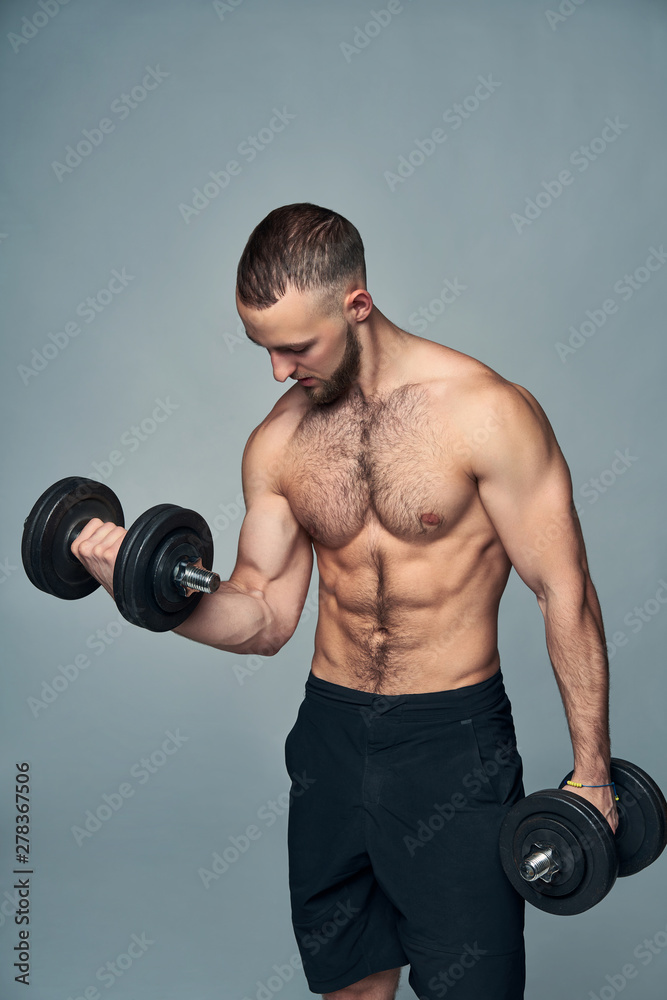 Strong shirtless sport man with dumbbells isolated Strong shirtless sport man with dumbbells isolated