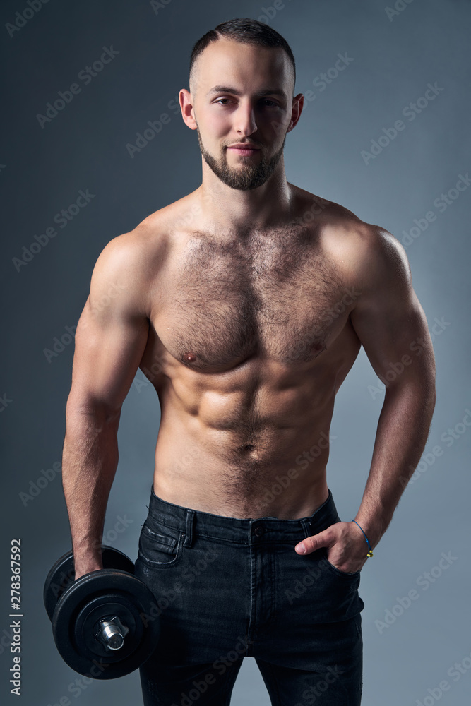 Strong shirtless sport man with dumbbells isolated