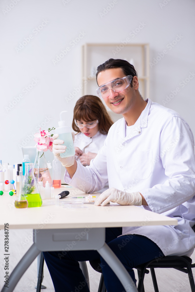 Two chemists working in the lab Two chemists working in the lab