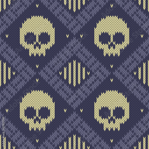 Knitted woolen seamless pattern with skulls in blue tones
