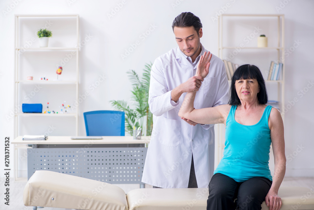 Fototapeta premium Mature woman patient visiting doctor