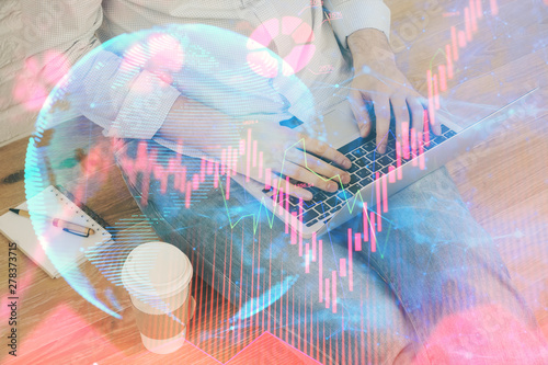 Wallpaper Mural Double exposure of businessman working on laptop on background. International business hologram in front. Concept of success. Torontodigital.ca