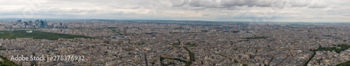 Huge aerial panorama photo of the 16th & 17th arrondissement of Paris with Arc de Triomphe in the centre. On the left side the Bois de Boulogne park and the business district La Défense can be seen. © H-AB Photography