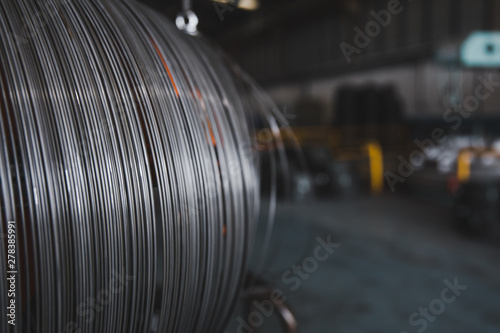 Pile of iron, metal wire rod or coil background for Construction industry. steel wire fence rolls. Steel wire tie rolls for construction and industrial. Coil of iron or steel background.