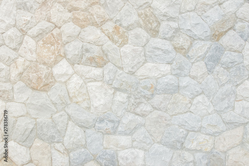 Brick stone wall stack of medieval natural stone texture background or rock strata boundary the rock seamless abstract and fragment of a walls from a gray.