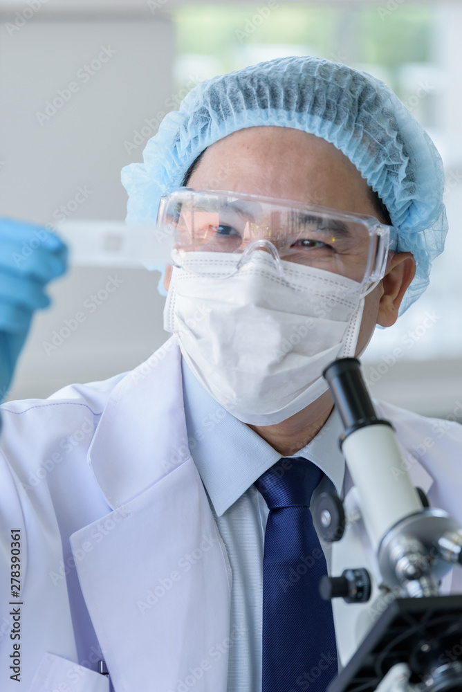 Asian man scientist researching and learning in a laboratory. Asian man scientist researching and learning in a laboratory.