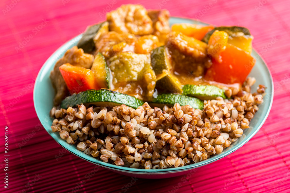 goulash with vegetables in a green bowl goulash with vegetables in a green bowl