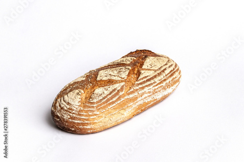 Fresh home-made bread with a crispy crust, on white background.