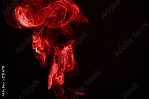 Red smoke on black background