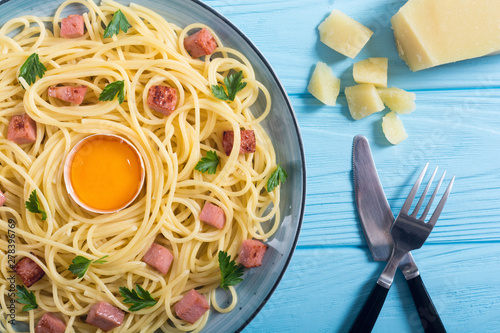 Itslian pasta carbonara with sausage and egg photo