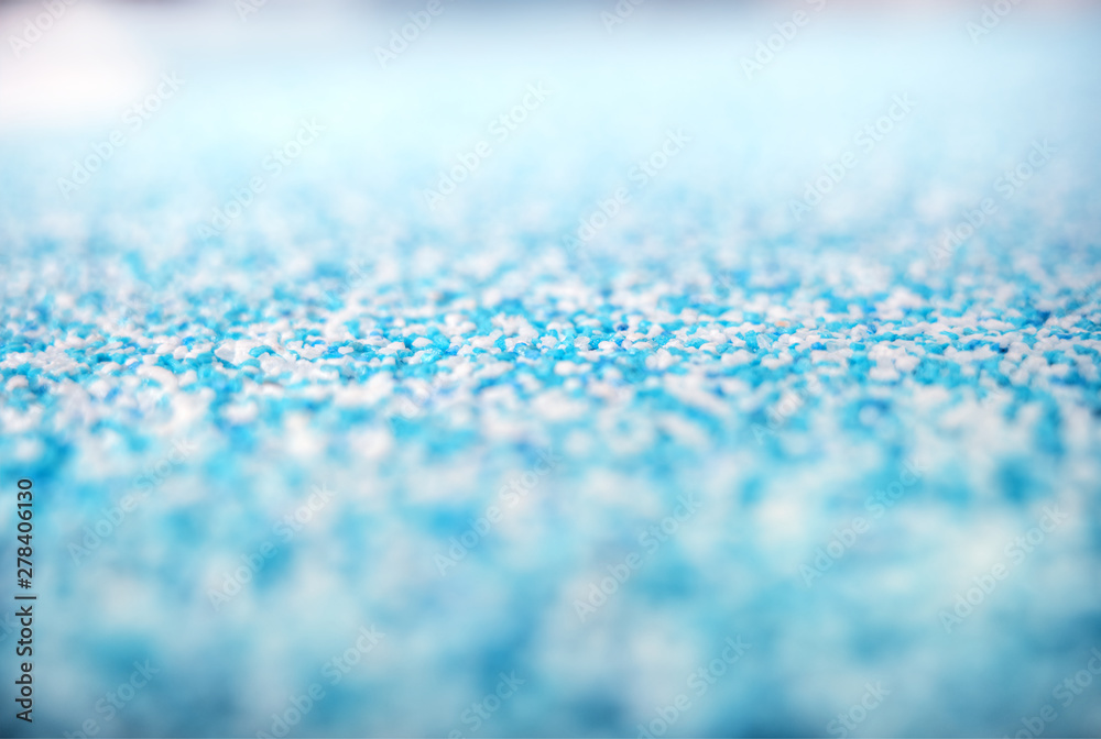 Cyan grainy crystal particles on the floor background