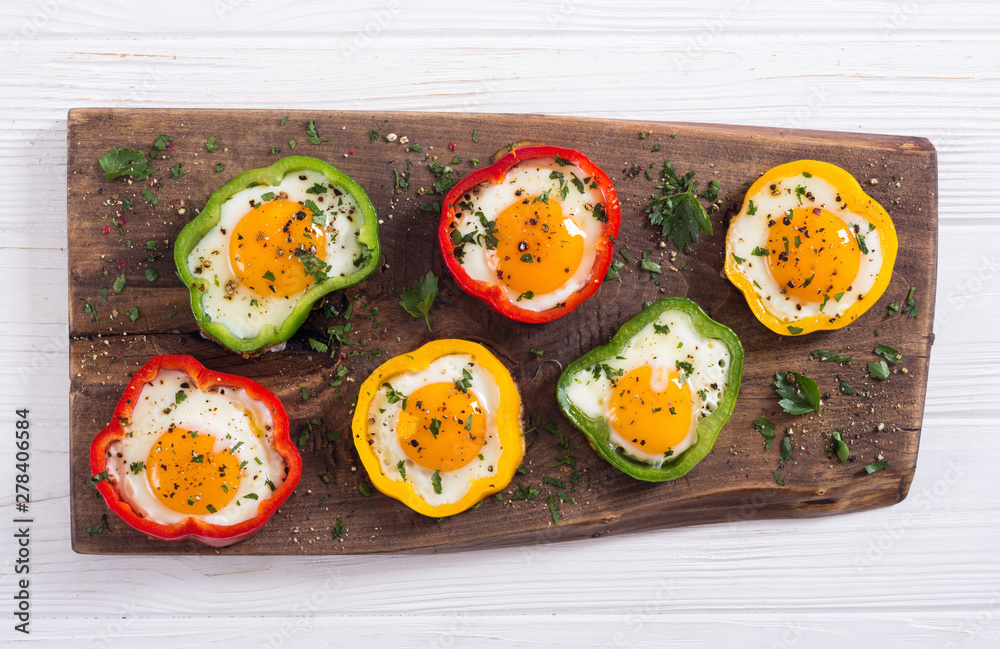 Yellow , red and green pepper with fried eggs Yellow , red and green pepper with fried eggs