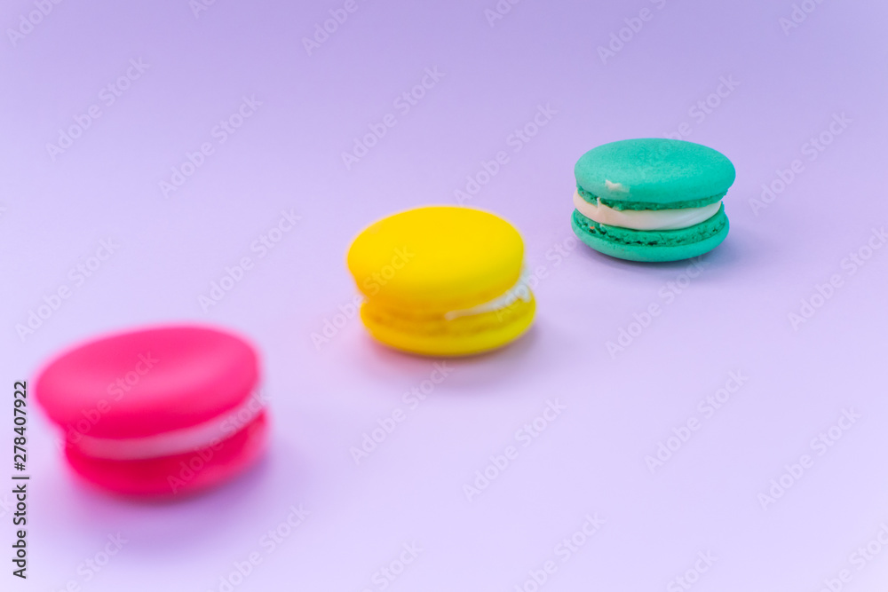 Close-up shot of colored macaroons in different position Close-up shot of colored macaroons in different position