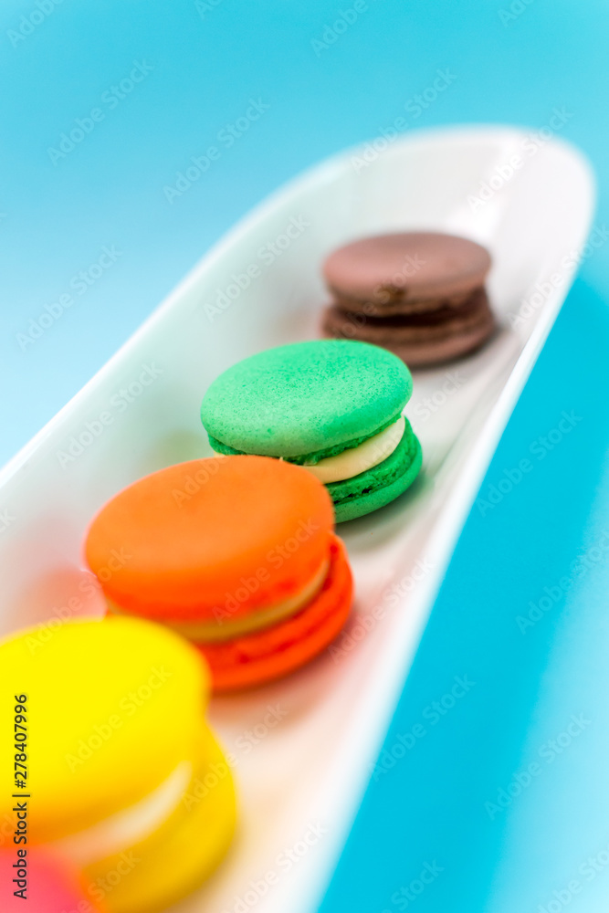 Close-up shot of colored macaroons in different position