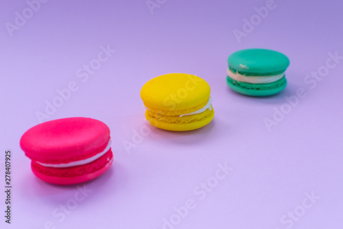 Close-up shot of colored macaroons in different position